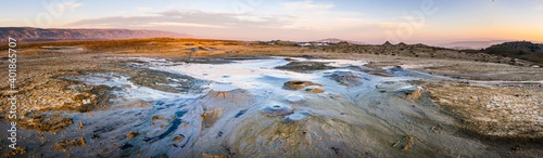 Wide panoramic view of Chachuna mud volcanoes with vibrant colors