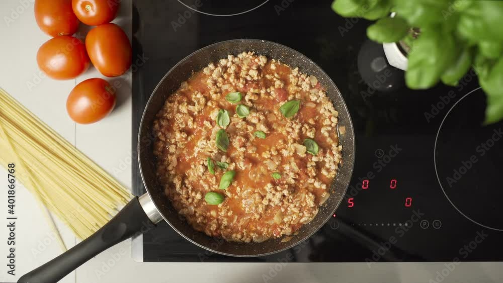 Cooking and stirring meat for spaghetti in frying pan. Cooking and stirring meat for spaghetti in frying pan.