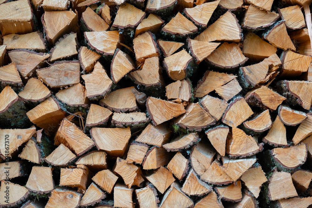 pile stacked natural sawn wooden logs background, top view, timber