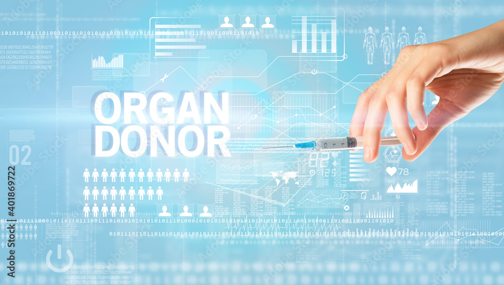 Close-up view of doctor's hand in a white glove holding syringe with ORGAN DONOR inscription, healthcare and medical concept Close-up view of doctor's hand in a white glove holding syringe with ORGAN DONOR inscription, healthcare and medical concept