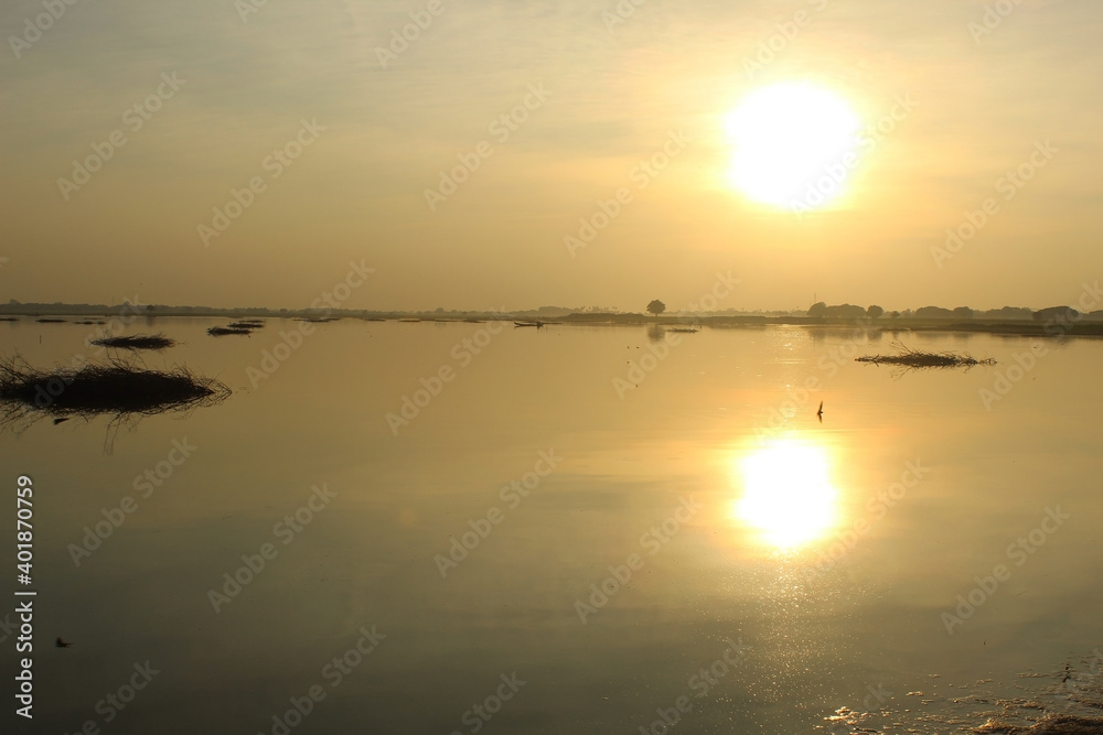 yellow sunset over the lake in Myanmar yellow sunset over the lake in Myanmar