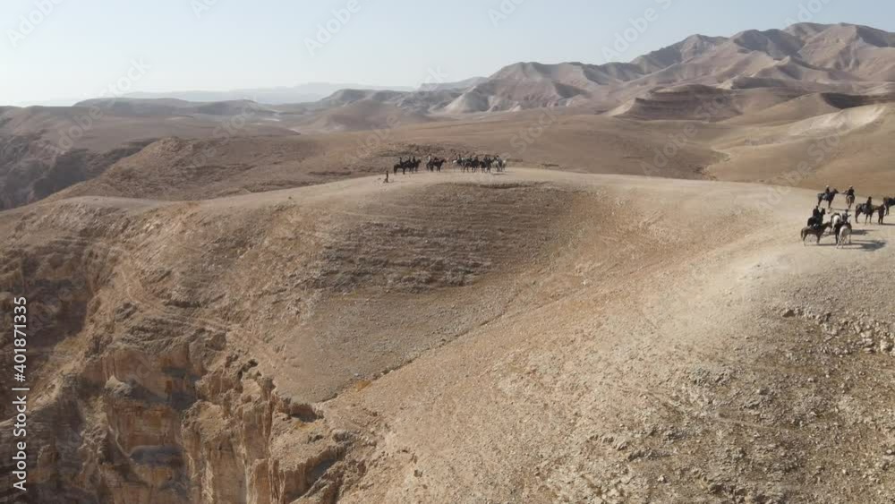 Arabian horse riding in the desert. endurance race in a beautiful desert landscape near cliffs and rural terrain , Aerial shot
Arabian horse riding in the desert. endurance race in a beautiful desert landscape near cliffs and rural terrain , Aerial shot