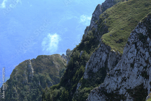 view of the valley from the top of the rocky cliff during sunny summer day on Stara planina (Dry mountain) in Serbia