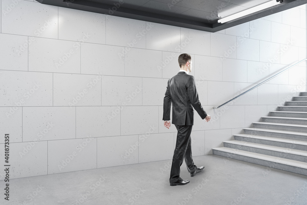 Fototapeta premium Businessman walking in contemporary metro station