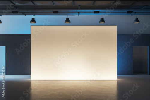 Modern museum interior with illuminated billboard
