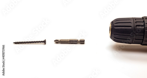 Drill bit and self-tapping screw on white background, isolated, selective focus