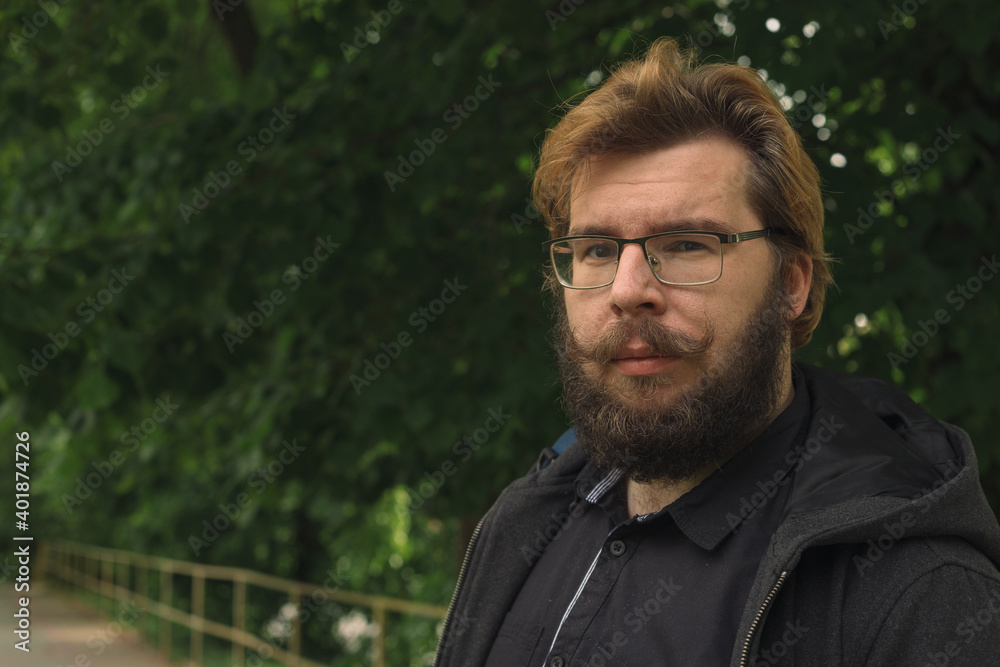 rustic man middle adult age with beard and mustache on face in garden outdoor spring environment space rustic man middle adult age with beard and mustache on face in garden outdoor spring environment space