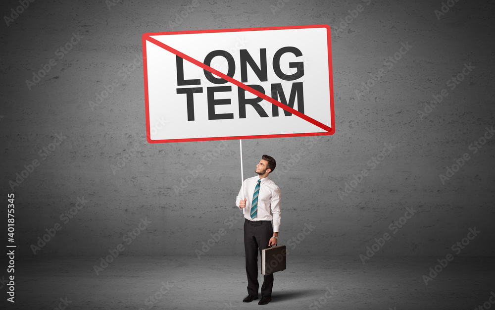 business person holding a traffic sign with LONG TERM inscription, new idea concept business person holding a traffic sign with LONG TERM inscription, new idea concept