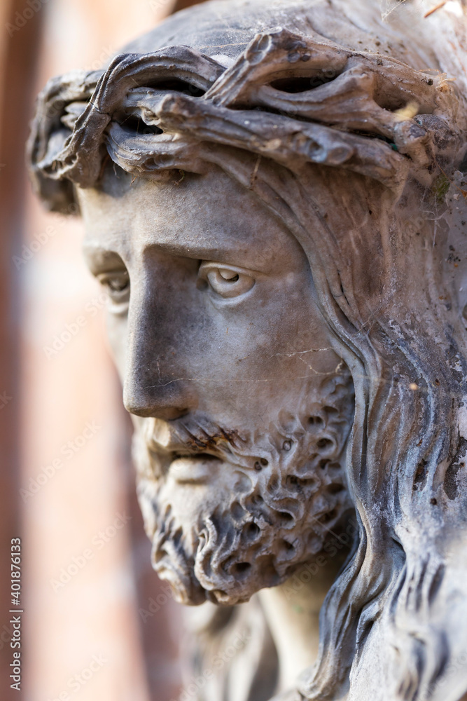 Historic Jesus on the winter mystery old Prague Cemetery, Czech Republic