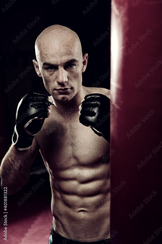 Mixed Martial Arts Fighter in the Gym wearing boxing Gloves
