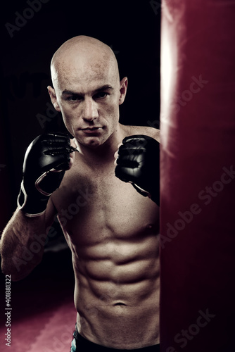Mixed Martial Arts Fighter in the Gym wearing boxing Gloves © Spanic