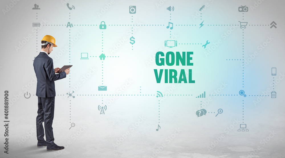 Engineer working on a new social media platform with GONE VIRAL inscription concept Engineer working on a new social media platform with GONE VIRAL inscription concept