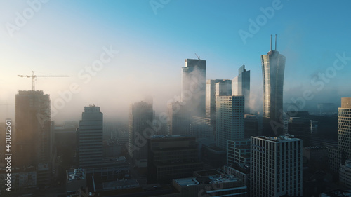 Warsaw business center  skyscrapers  buildings and cityscape in the morning fog  aerial. High quality photo