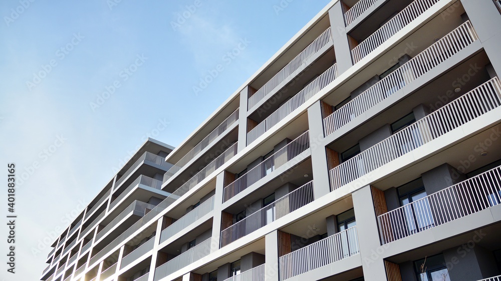 Facade of a modern apartment building with balconies. No people. Real estate business concept.