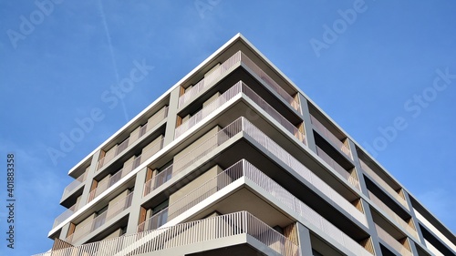 Facade of a modern apartment building with balconies. No people. Real estate business concept.