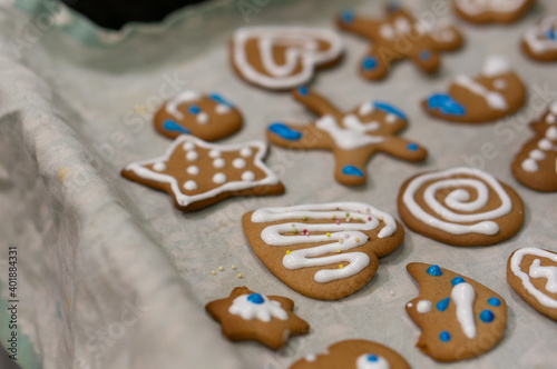 A selective focus shot of cute decorated Christmas gingerbread cookies photo