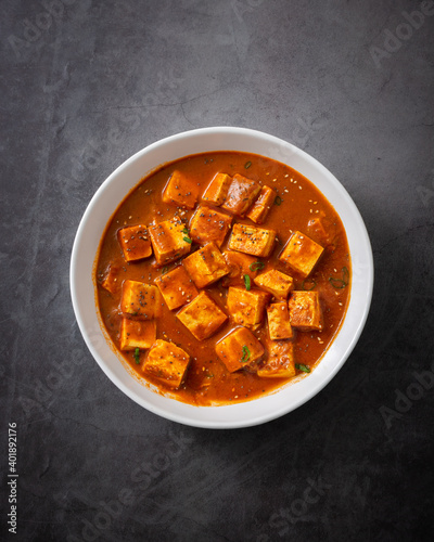 Fotografie A vertical shot of traditional Indian paneer butter masala or cheese cottage cur