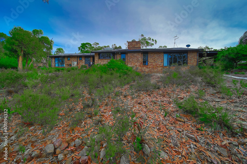 Residential house in Dural a country suburb in Sydney NSW Australia with lush green trees and grass  photo