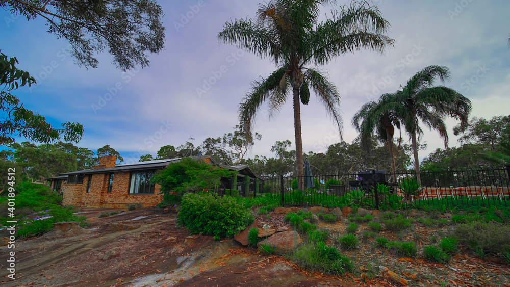 Residential house in Dural a country suburb in Sydney NSW Australia with lush green trees and grass 