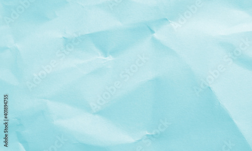 turquoise colored crumpled paper texture background for design, decorative.