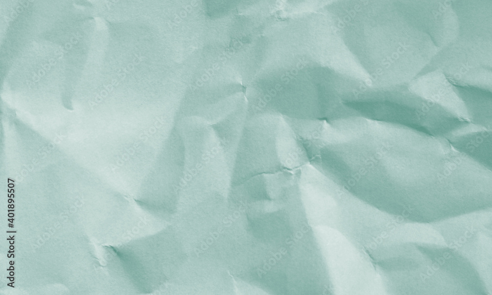 Fototapeta premium grass green colored crumpled paper texture background for design, decorative.