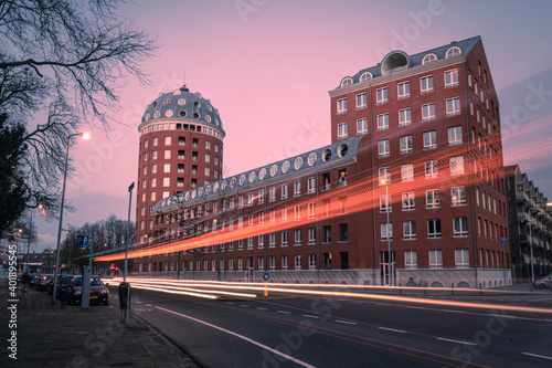 Light trails of traffic in the city with historic building in background