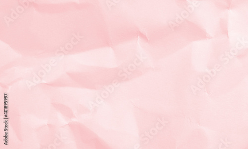pink colored crumpled paper texture background for design, decorative.
