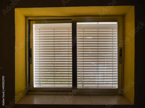 Canvas Print A window with old blinders