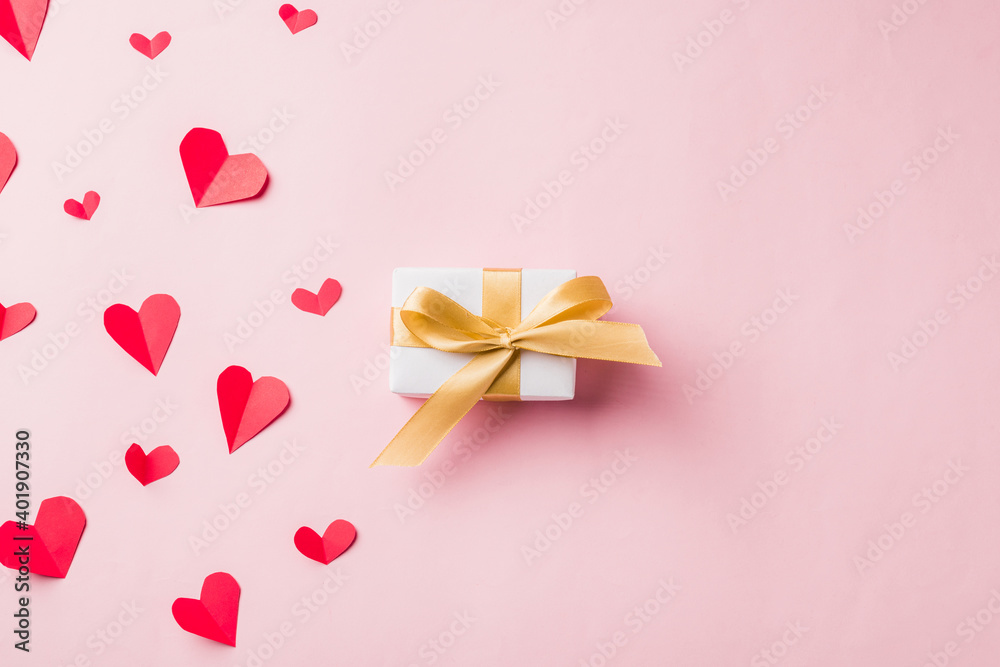Valentines' day background. White gift box postcard and paper flying elements hearts cut greeting gift card isolated on pink background, Symbol of love. Happy Mother's, Valentine's Day concept Valentines' day background. White gift box postcard and paper flying elements hearts cut greeting gift card isolated on pink background, Symbol of love. Happy Mother's, Valentine's Day concept