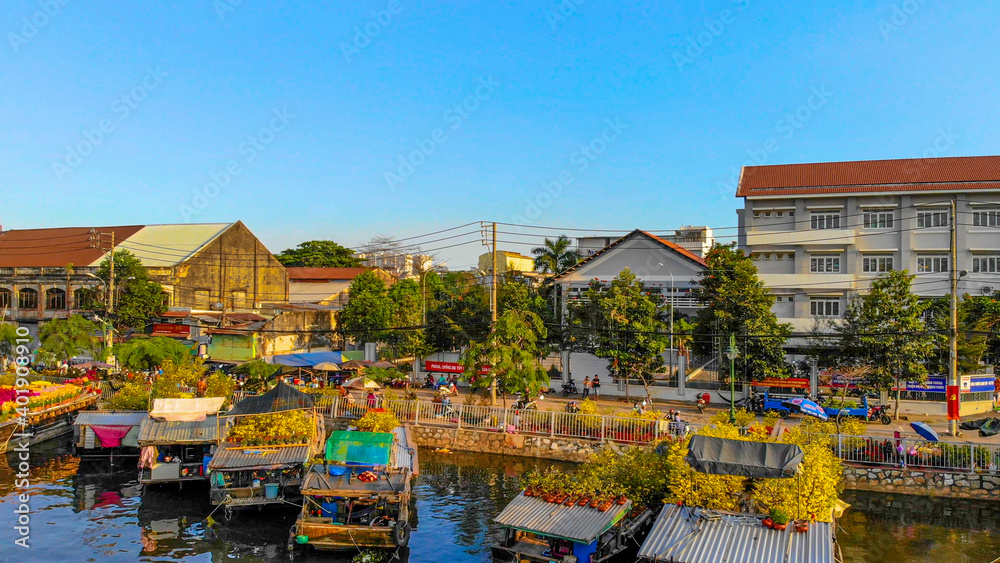 Aerial view of Ben Binh Dong (Binh Dong harbour) in lunar new year ( Tet Festical in Vietnam) with flower boats along side the river.