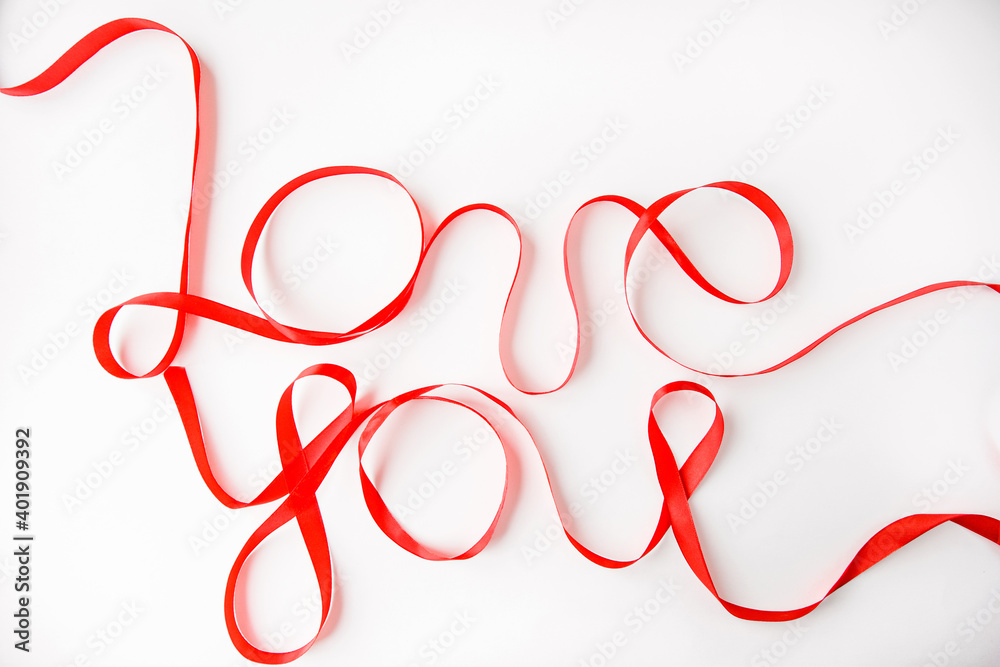 the inscription love you with a red ribbon on a white background