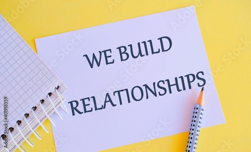 WE BUILD RELATIONSHIPS written on white paper. Business photo showcasing initiate good working relationships with others.
