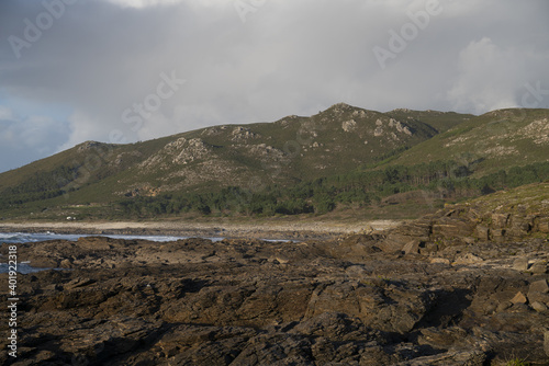 A beautiful shot of the mountain landscapes on the Coast of Carnota, Galicia, Spain photo