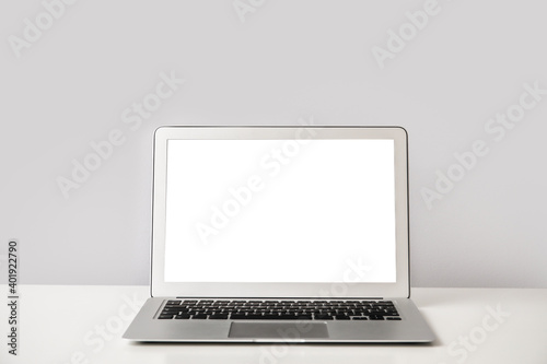 Modern laptop on table in office