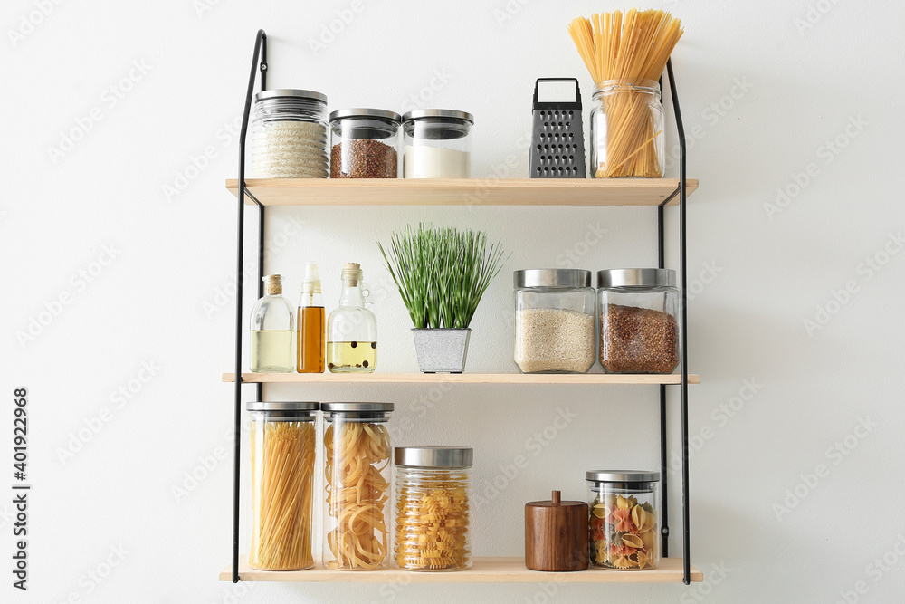 Set of jars with products on kitchen shelves - obrazy, fototapety, plakaty 