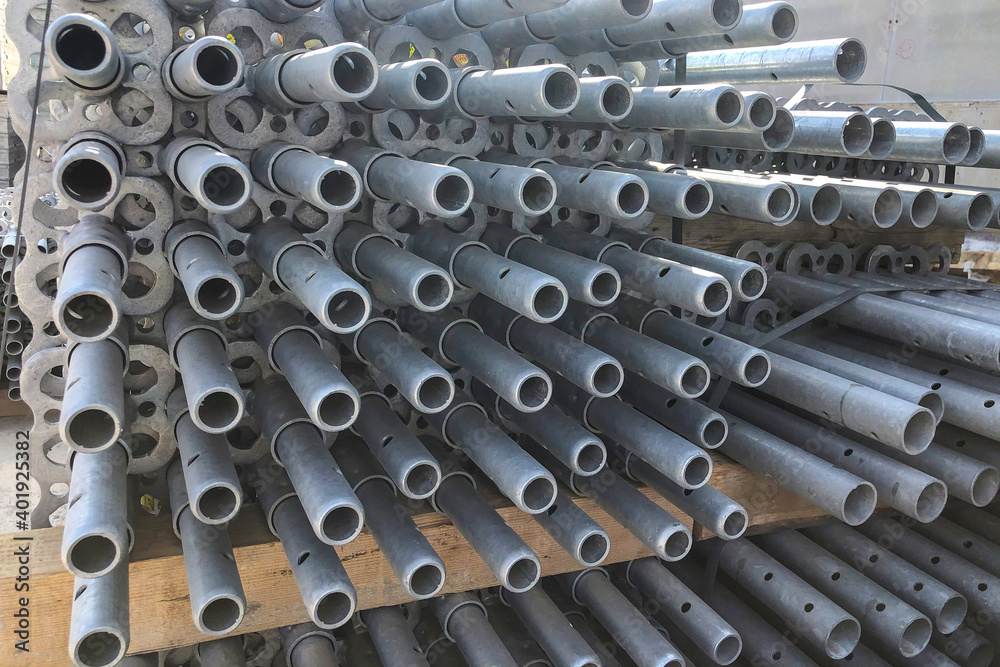 Scaffolding parts at construction site. Auxillary construction equipment Scaffolding parts at construction site. Auxillary construction equipment