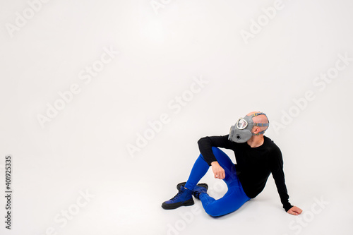 Funny strange man in respirator posing over white background © benevolente