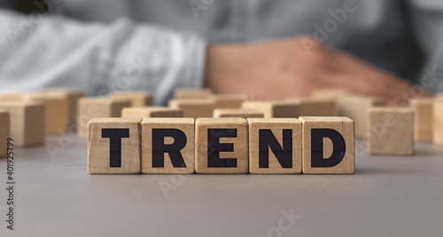 The word TREND made from wooden cubes. Shallow depth of field on the cubes