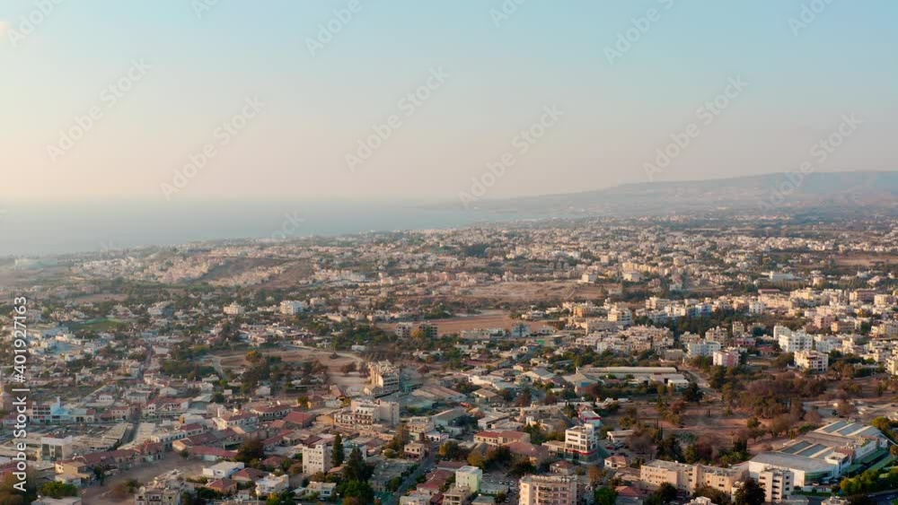 Aerial shot Paphos Cyprus. Drone flying over the center of the historic city x houses, skyscrapers in a landscape with a background of the sea. Aerial shot Paphos Cyprus. Drone flying over the center of the historic city x houses, skyscrapers in a landscape with a background of the sea.