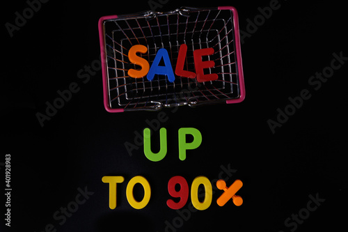 Black friday concept. Sale up to 90 per cent. Shopping basket at black
