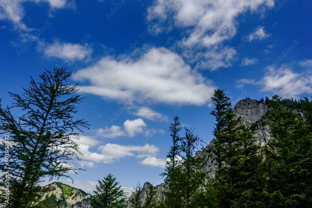 beautiful clouds on blue sky while hiking in the mountains