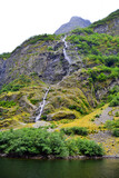 The mountain and the waterfall. Beautiful scenic view. Summer in Norway, Naeroyfjord. Vertical view