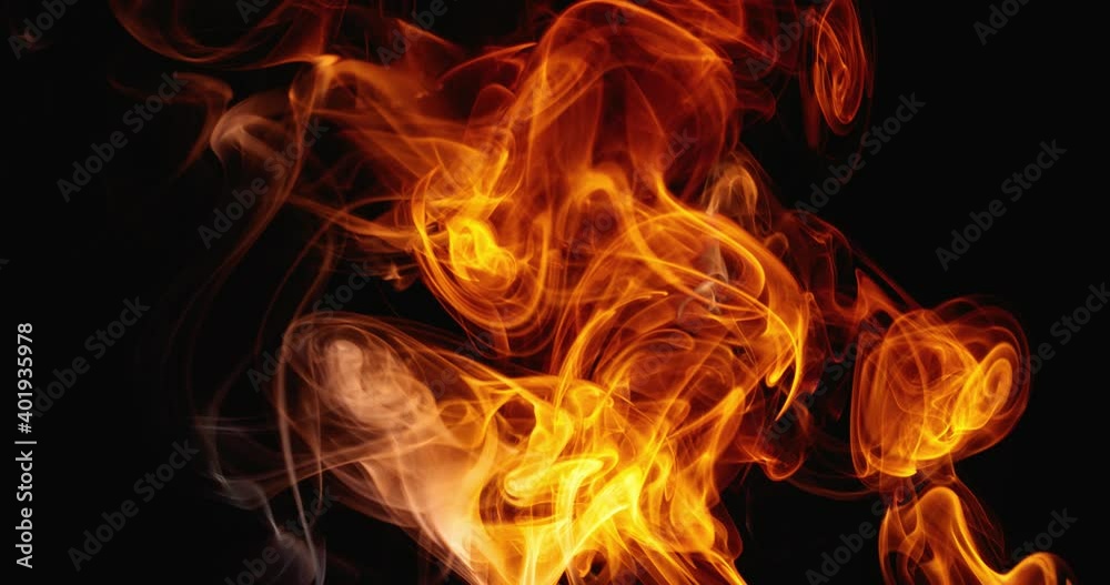 Surreal slow dance of clouds of colored smoke. Swirls of fabulous smoke on a dark background. Abstract colored tongues of flame. Slow motion. Surreal slow dance of clouds of colored smoke. Swirls of fabulous smoke on a dark background. Abstract colored tongues of flame. Slow motion.