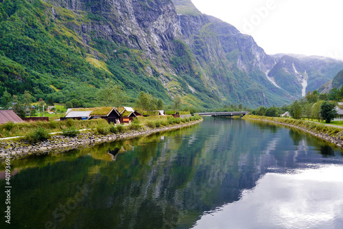 Gudvangen, Norway - a viking houses with grass-covered roofs. Traditional wooden houses showing the medieval life in the viking village. 