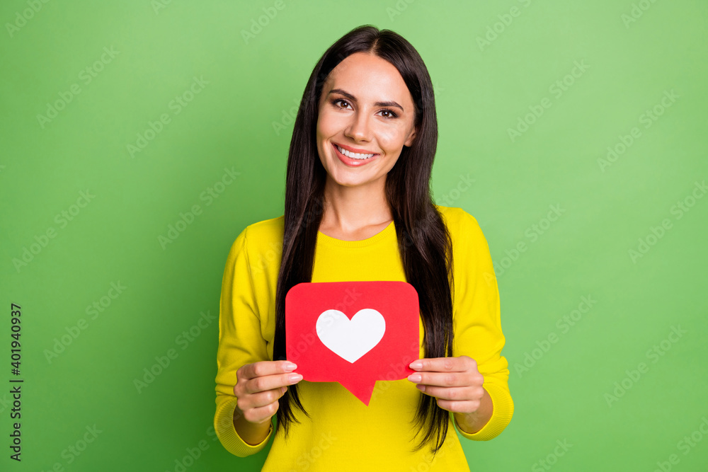 Photo of pretty person hands hold like card toothy smile wear sweater isolated on green color background Photo of pretty person hands hold like card toothy smile wear sweater isolated on green color background