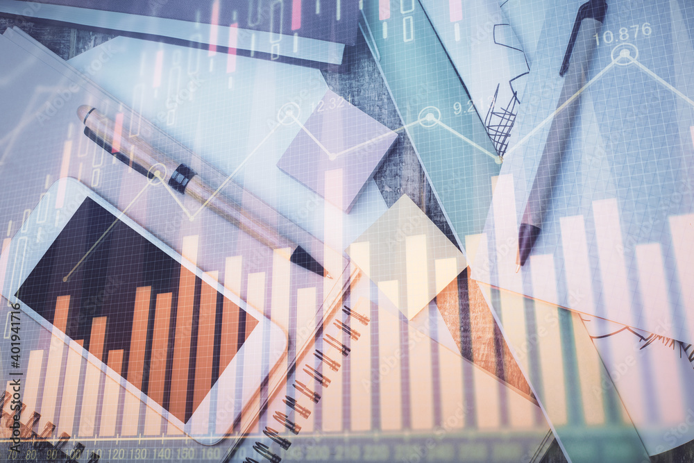 Multi exposure of forex graph hologram over desktop with phone. Top view. Mobile trade platform concept. Multi exposure of forex graph hologram over desktop with phone. Top view. Mobile trade platform concept.