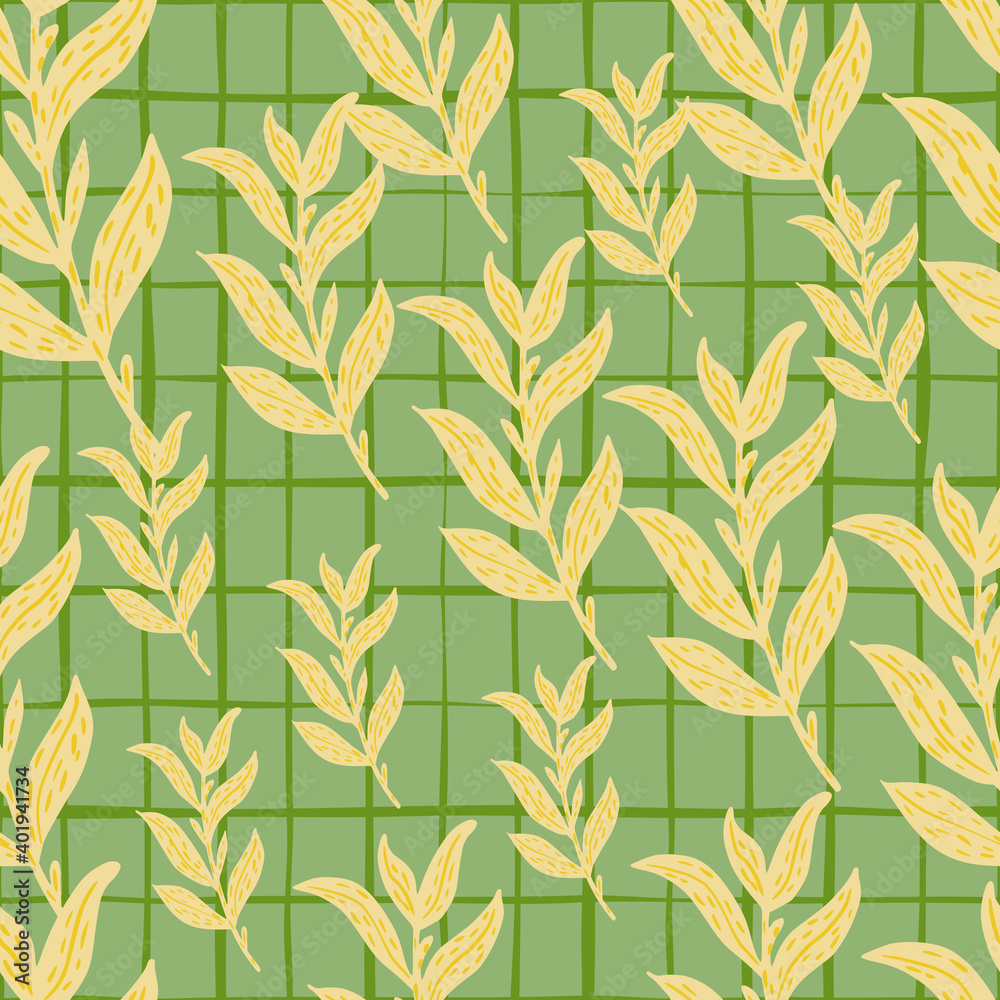 Fototapeta premium Random seamless pattern with pale yellow leaf branches ornament on green chequered background.