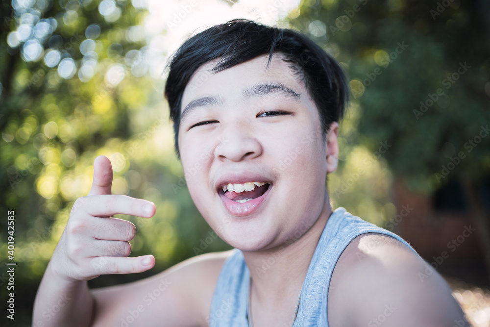 Portrait of a cheerful Asian child - Adorable Asian child waving his hand. Portrait of a cheerful Asian child - Adorable Asian child waving his hand.