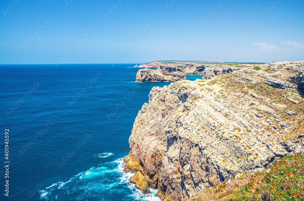 Rocks and cliffs of Atlantic Ocean near Cape Saint Vincent Cabo de Sao Vicente southwesternmost point of mainland Europe, Pedra das Gaivotas island, Portuguese coastline, Algarve district, Portugal.