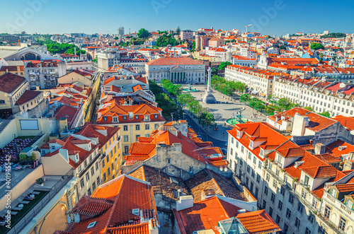 Aerial panoramic view of Lisboa historical city centre Baixa Pombalina Downtown with Rossio King Pedro IV Square Praca Dom Pedro IV, Queen Maria II National Theatre and Column of Pedro IV, Portugal.